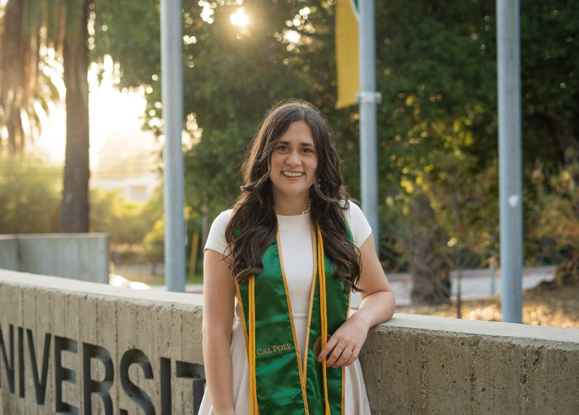 Graduate posing for photograph